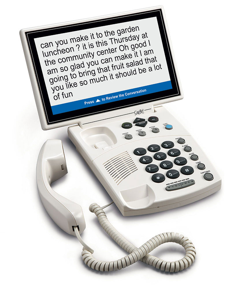White CapTel captioned telephone with a large screen displaying conversation captions above the keypad and handset.